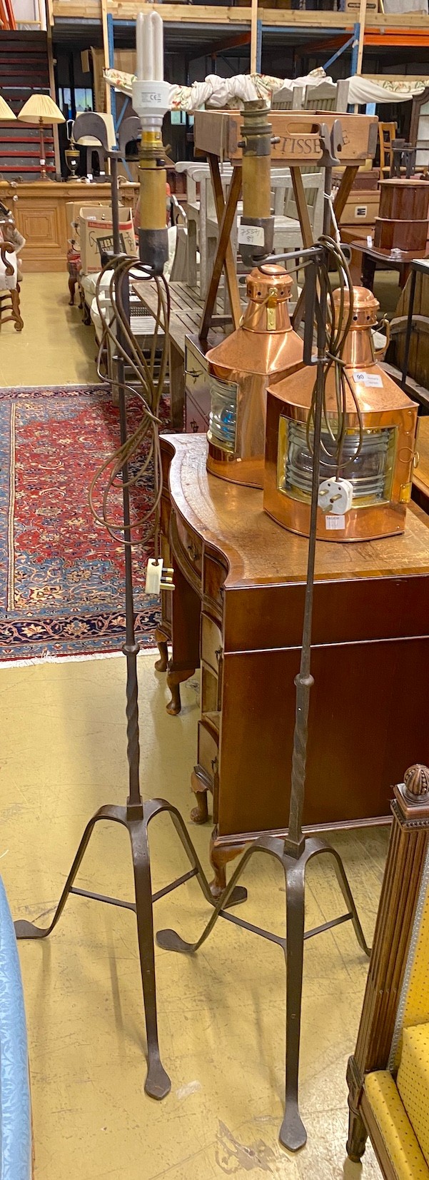 A pair of wrought iron floor lamps, height 160cm